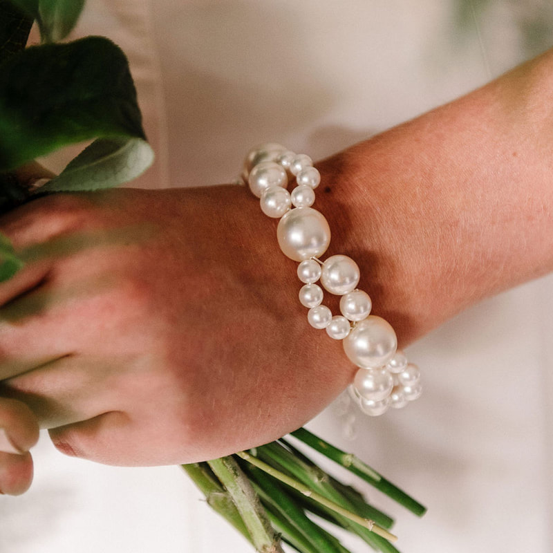 For a simple bridal statement in twists of pearl, style your wedding dress with the Nerina bracelet ARW 612 by Arianna Tiaras at Limelight Occasions bridal boutique near Huddersfield, Wakefield and Leeds