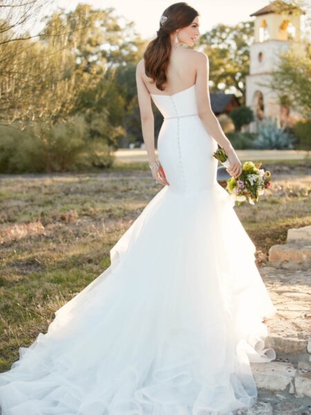 Back view of Essense of Australia D2027 mermaid wedding dress in plain fabric with a waterfall skirt in layers of tulle.