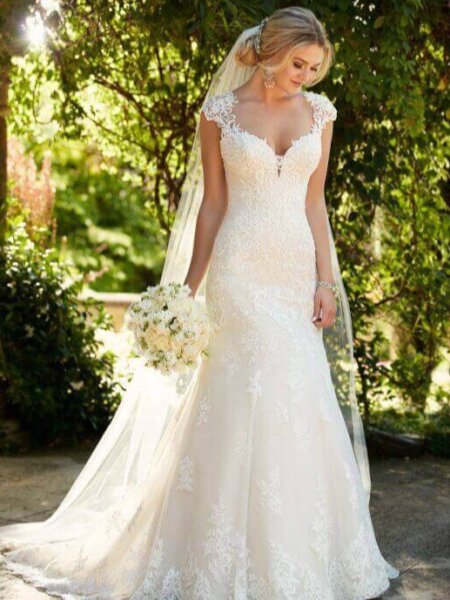 Bride wearing Essense of Australia D2262 lace wedding dress with sweetheart neckline and cap sleeve.