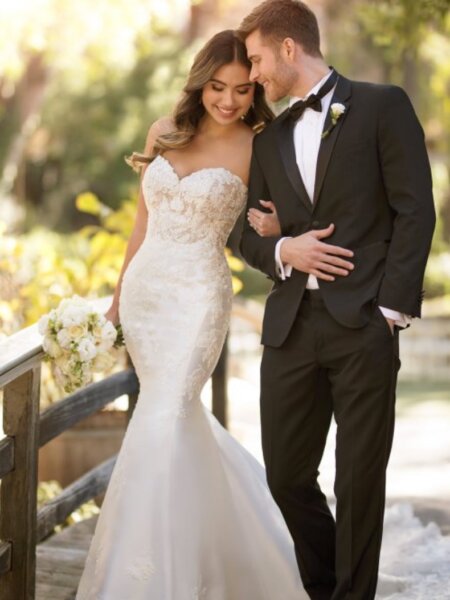 Essense of Australia D2812 plain mermaid wedding dress with beaded lace detail front view with groom.
