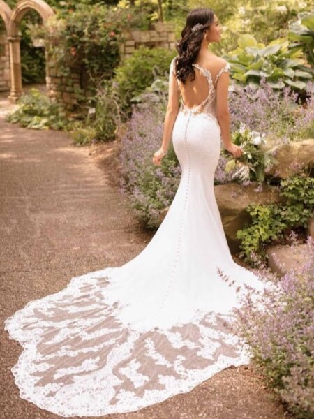 Essense of Australia D2849 fitted wedding dress with peep hole and statement lace train back view.