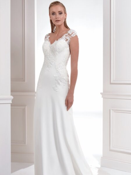 Libelle Laurel slim Aline wedding dress in plain crepe with lace detail to the bodice and straps front view.