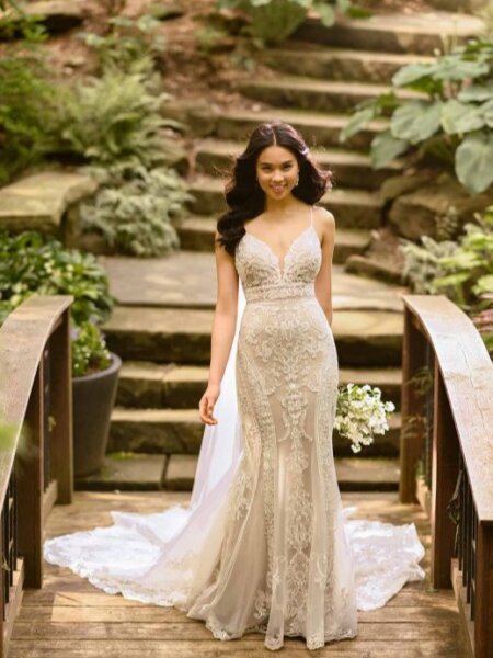 Essense of Australia D2887 fitted lace wedding dress with sheer waistband and statement train front view.