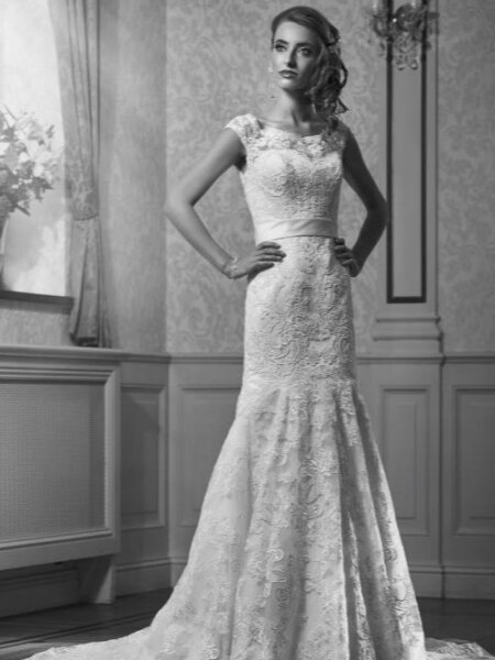 Annais Orvieti fitted lace wedding dress with high neck cap sleeves and low fitted back front view.