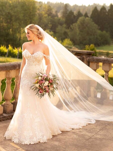 Essense of Australia D2642 mermaid lace wedding dress with off the shoulder straps and floral detail front.