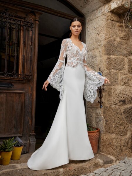Herve Paris fitted wedding dress with lace sleeves.