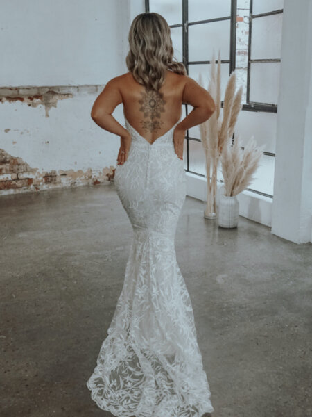 Rachel Rose Angel fitted wedding dress low back and train.