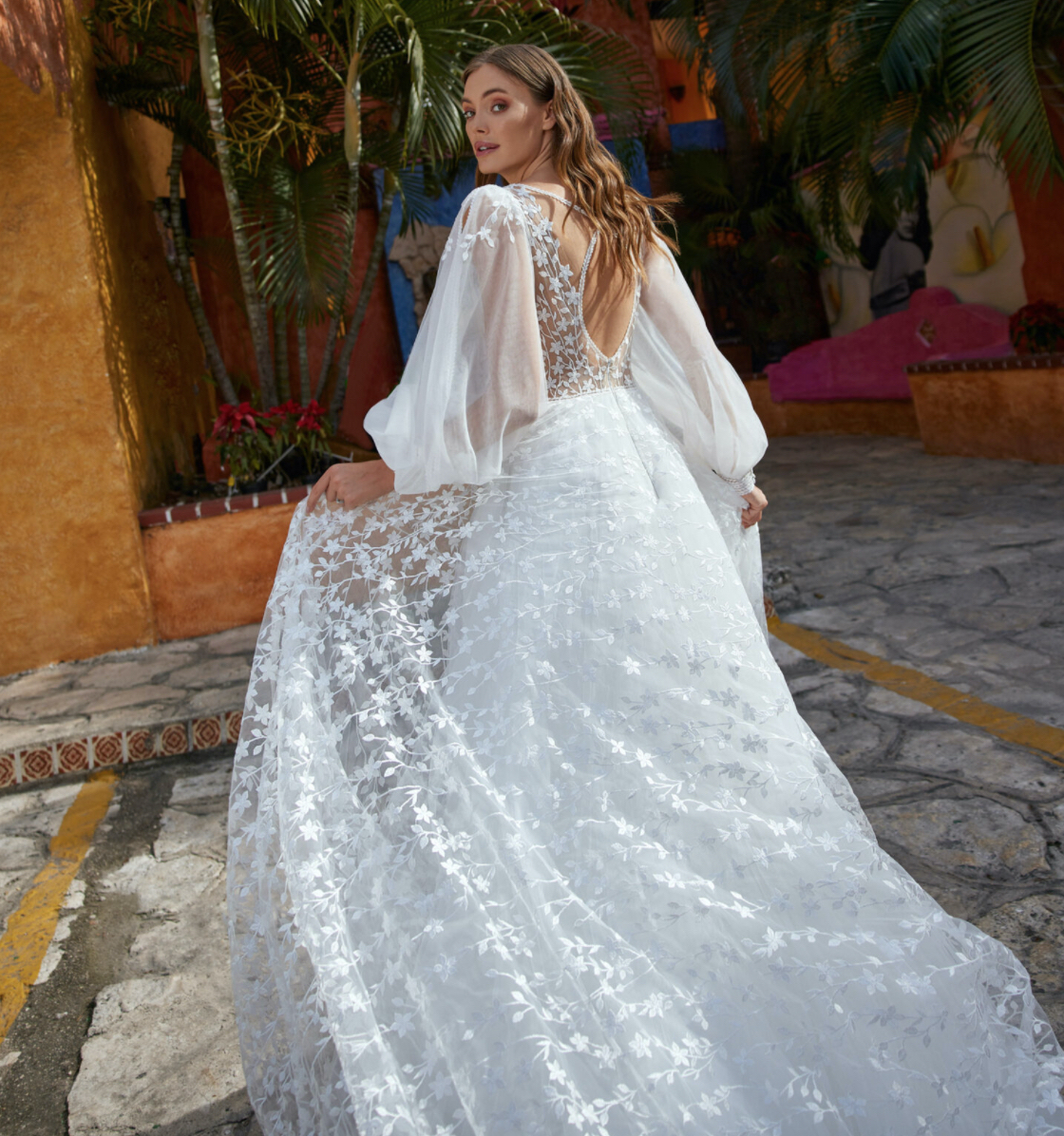 Libelle Bridal Hiba romantic A line wedding dress with three dimensional lace and long floaty sleeves back.