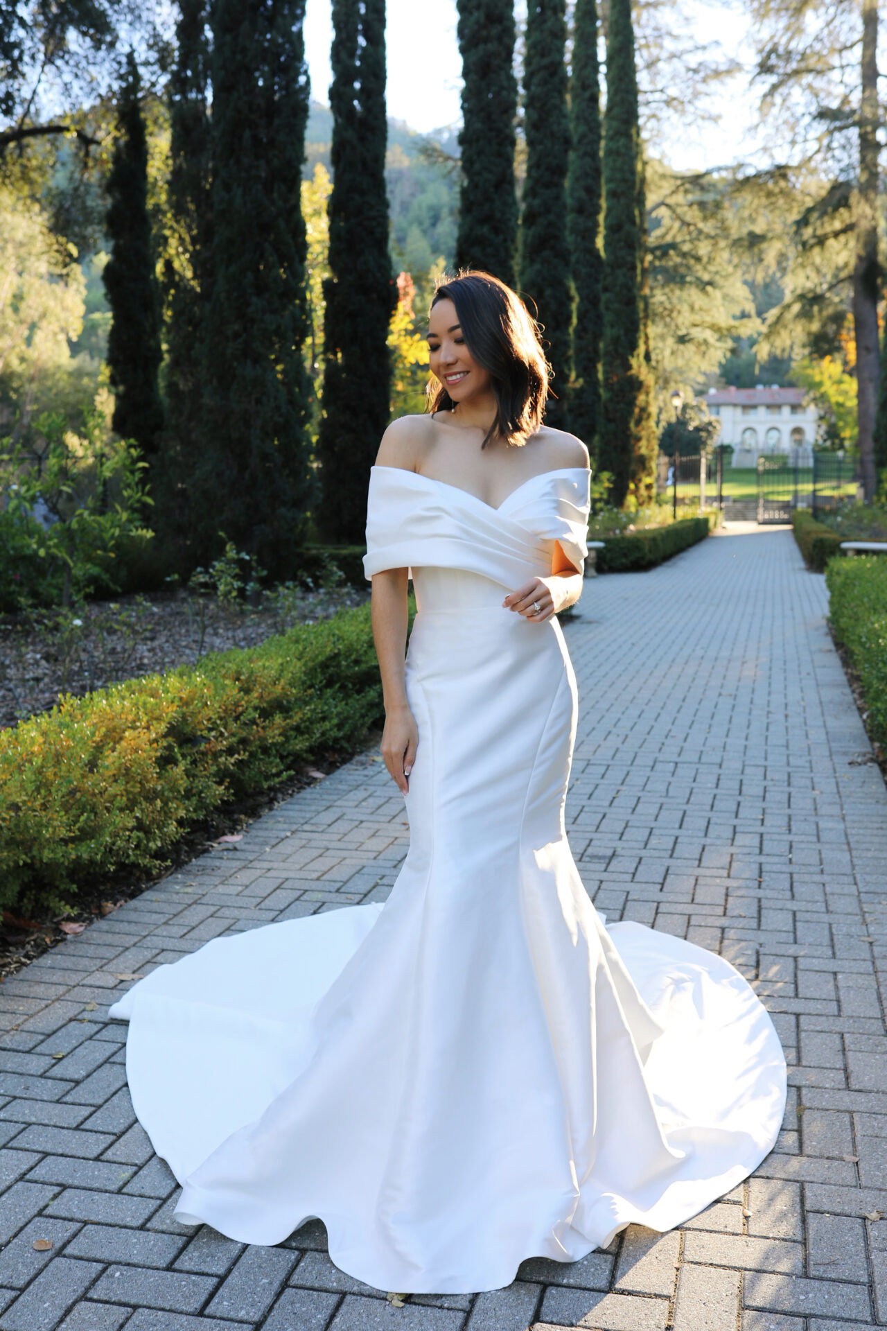 Essense of Australia D3754 off the shoulder mermaid wedding dress in plain fabric with stunning statement collar full length front view.
