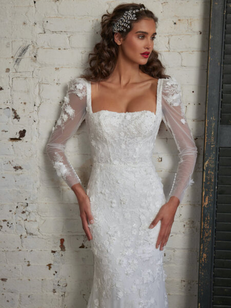 Calla Blanche 123249 Anthea square neck fitted wedding dress with long sleeves in pretty botanic lace close up front view.