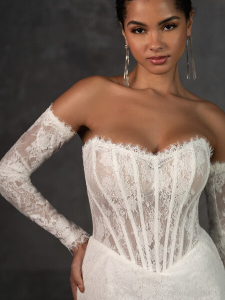 Essense of Australia D4287 fitted lace wedding dress with strapless basque bodice and detachable long sleeves close up front view.