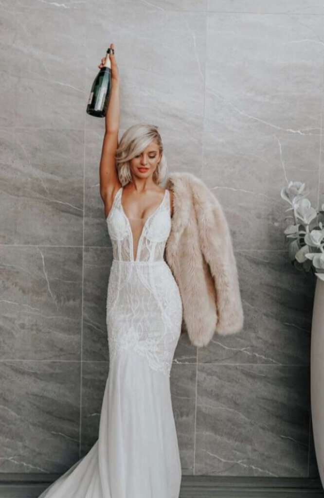 Sale wedding dress fitted lace wih plunge V neckline front.