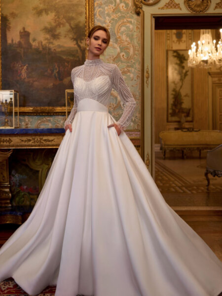 Randy Fenoli Innocenta ballgown wedding dress with stunning beaded high necked long sleeved bodice and plain ballgown skirt with wide waistband front.