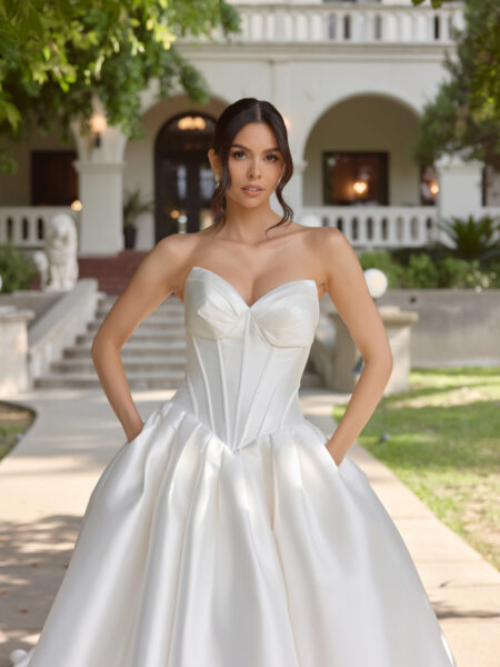 Essense of Australia D4410 plain ballgown wedding dress with beautiful drop waist boned basque bodice close up front view with pockets.