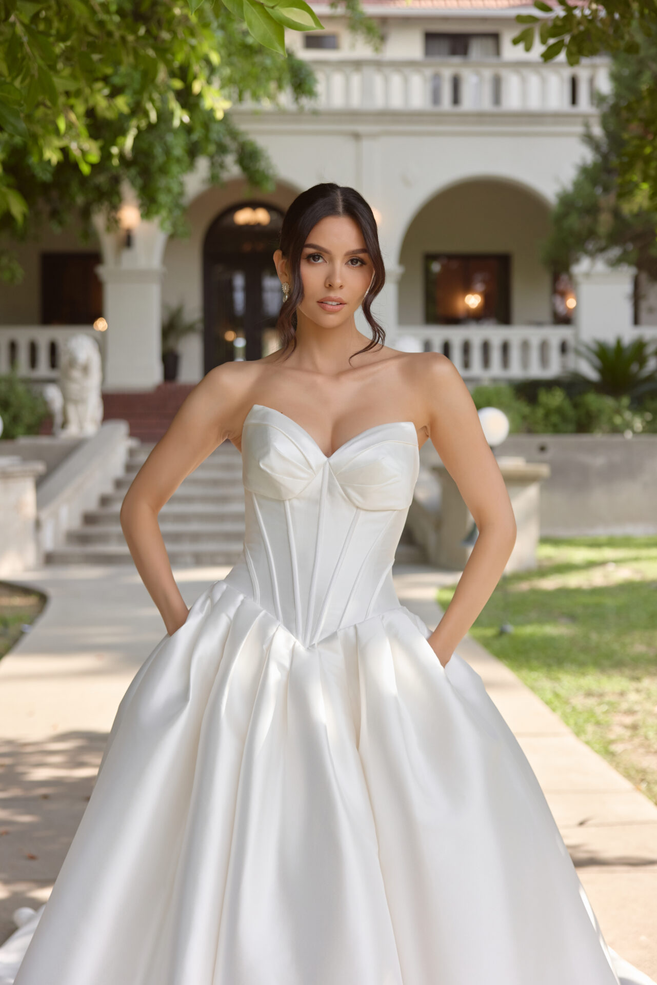 Essense of Australia D4410 plain ballgown wedding dress with beautiful drop waist boned basque bodice close up front view with pockets.
