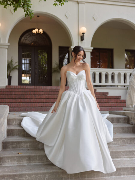Essense of Australia D4410 plain ballgown wedding dress with beautiful drop waist boned basque bodice full length front view.