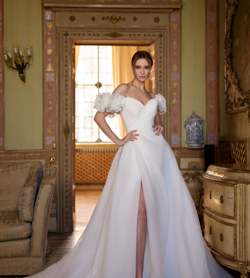 Randy Fenoli Idalia stunning plain organaza ballgown wedding dress with sweetheart neckline detachable drop 3D floral sleeves and statement 3D floral detail on the train front view.