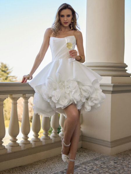 Randy Fenoli Jazz a stunning mini ballgown wedding dress in plain organza with layers of three dimensional flowers on the underskirt fun, flirty and romantic front view.