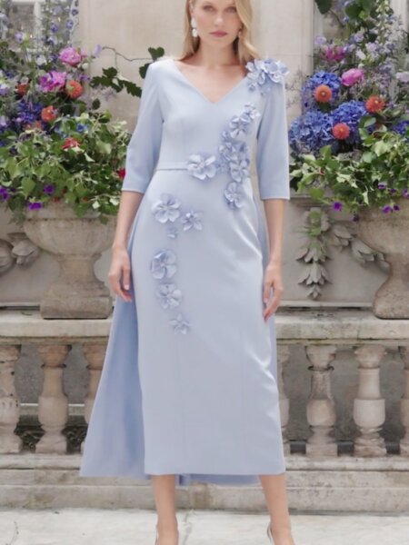 John Charles 29334 blue fitted mother of the bride dress with overskirt, V neckline and sleevesModern occasion wear for weddings, the races, cruises and black tie events. Matching hats, shoes and bags available.