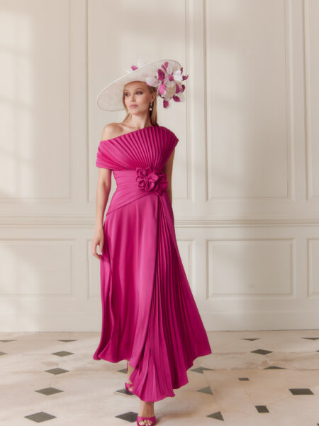 John Charles 66710 hot pink mother of the bride dress with A line pleated skirt and statement asymmetric bodice.
