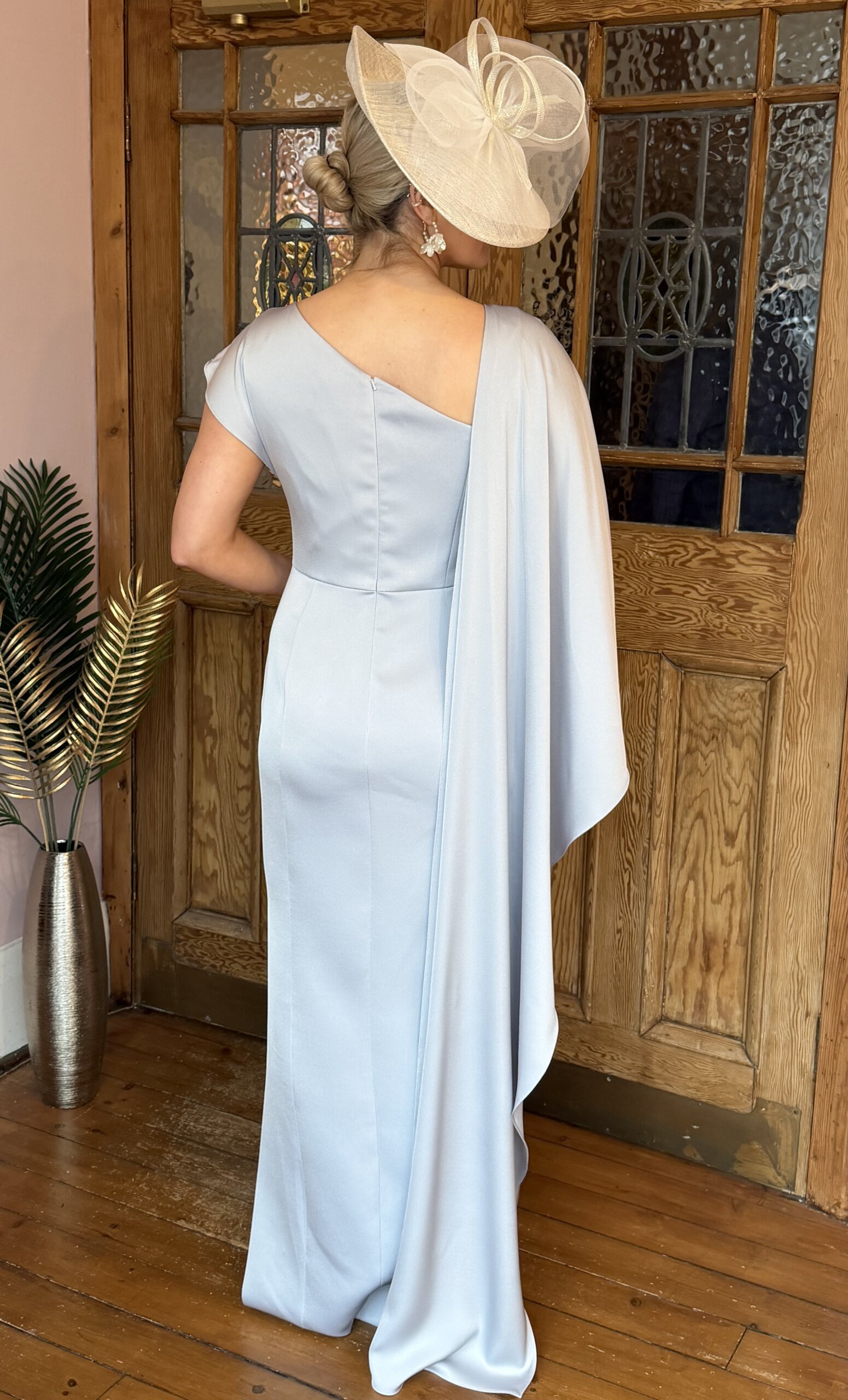 Maisonel 3075 pastel blue full length mother of the bride dress with asymmetric capeModern, elegant occasion wear for weddings, the races, cruises and black tie events back view. Matching hats, shoes and bags available.