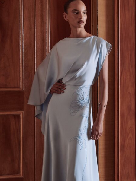 Maisonel 3109 mother of the bride dress in pastel blue with A symmetric skirt, bodice and sleevesModern, elegant occasion wear for weddings, the races, cruises and black tie events. Matching hats, shoes and bags available front view with video. 