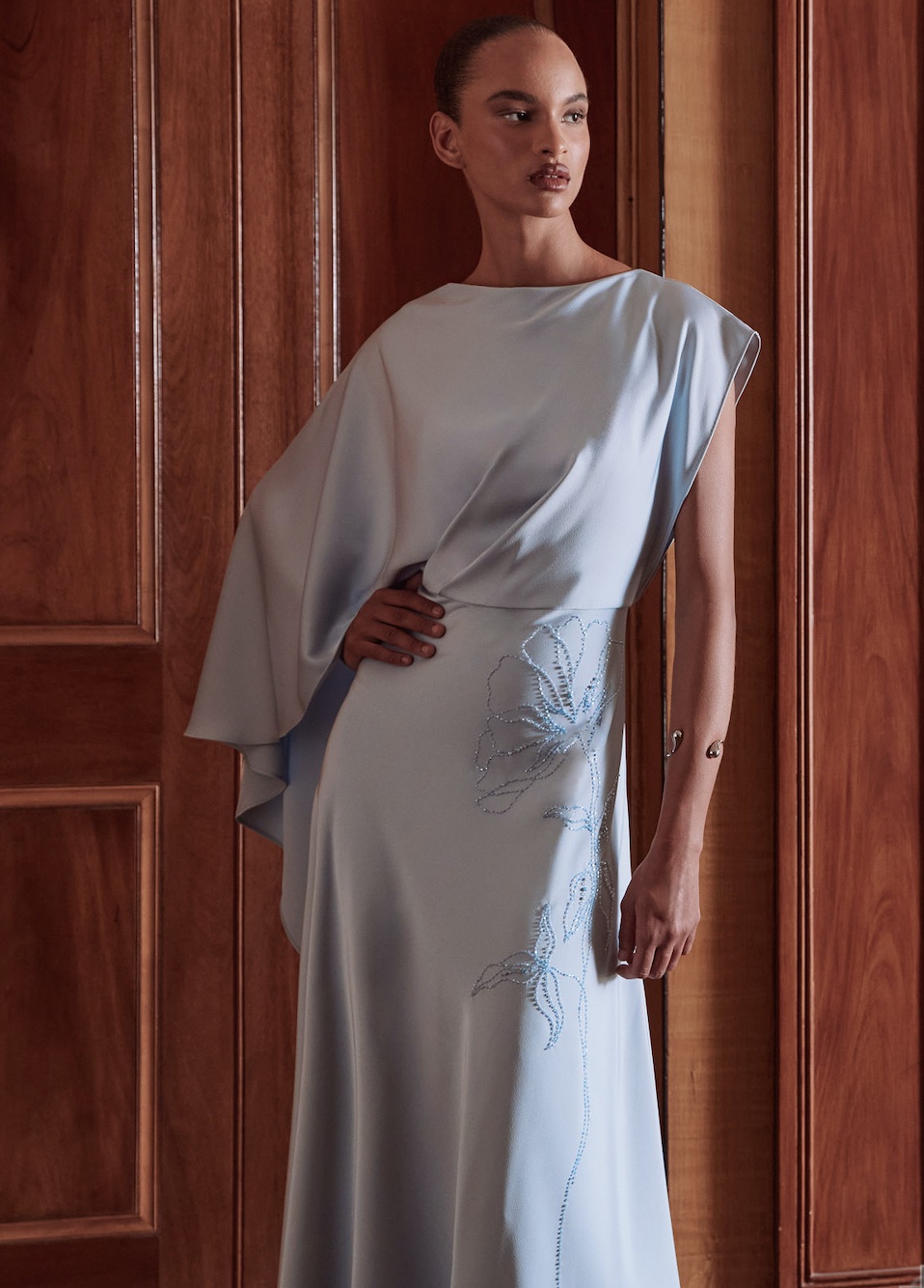 Maisonel 3109 mother of the bride dress in pastel blue with A symmetric skirt, bodice and sleevesModern, elegant occasion wear for weddings, the races, cruises and black tie events. Matching hats, shoes and bags available front view with video. 