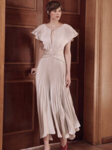 Maisonel 3129 blush pink mother of the bride dress pleated A line with cinched waistlineModern, elegant occasion wear for weddings, the races, cruises and black tie events. Matching hats, shoes and bags available Huddersfield boutique.