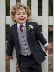 Peter Posh navy wedding suit for grooms men and boys with check tweed waistcoat available in a range of colours at our Huddersfield bridal boutique Yorkshire.