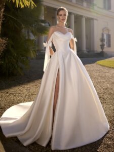 Jaqueline luxe ballgown wedding dress with basque bodice with pearl and sparkle inset optional drop straps and leg split designed by Randy Fenoli famous Say Yes to the Dress stylist at Kleinfelds now available in our Huddersfield boutique near wakefield.