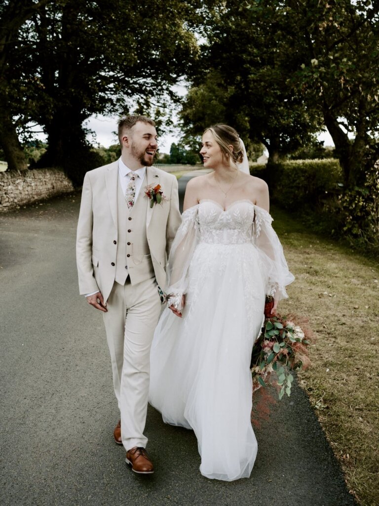 Real bride Jenny wearing the stunning Essense of Australia D3787 bridal gown on her wedding day in West Yorkshire.