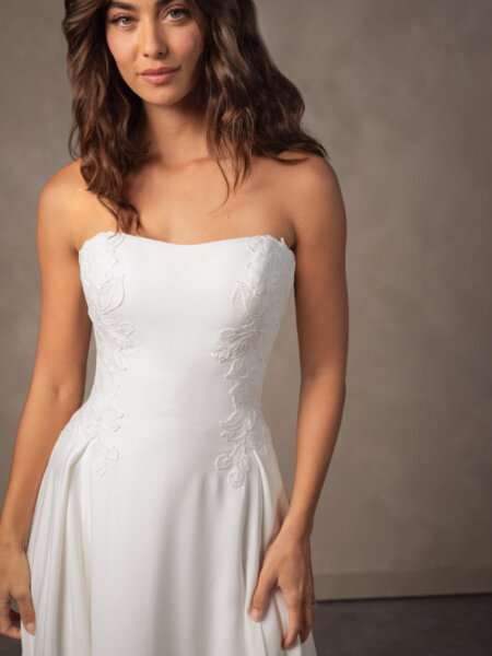Essense of Australia D4504 Aline wedding dress in plain liquid crepe with some lace detail front close up.