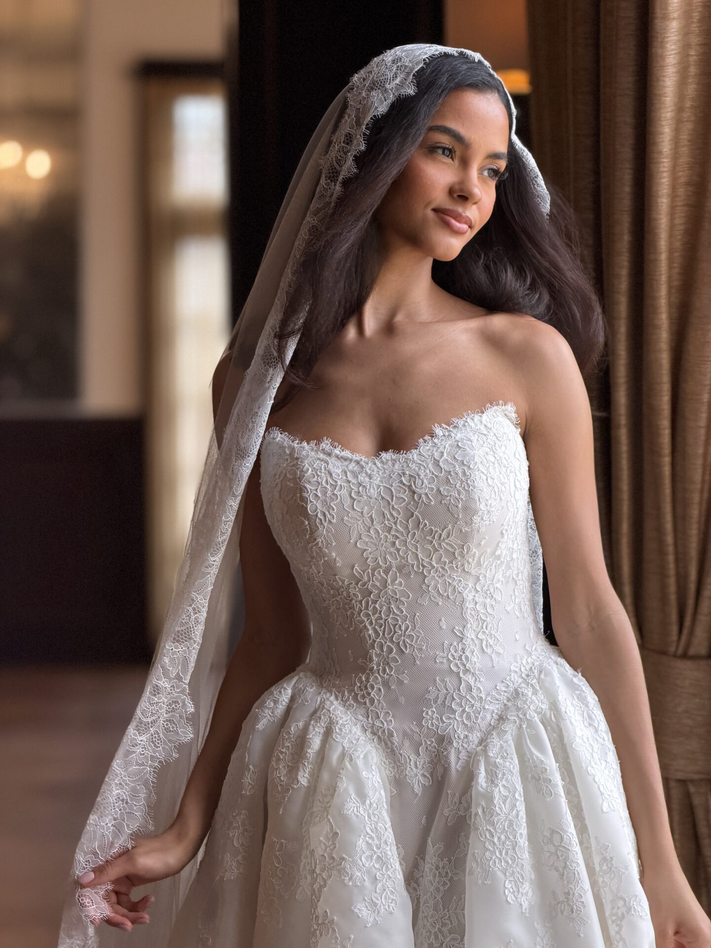 Essense of Australia D4573 lace ballgown wedding dress close up front with veil.
