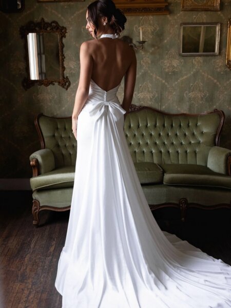 Essense of Australia D4614 plain halter neck wedding dress with detachable bow train back view.
