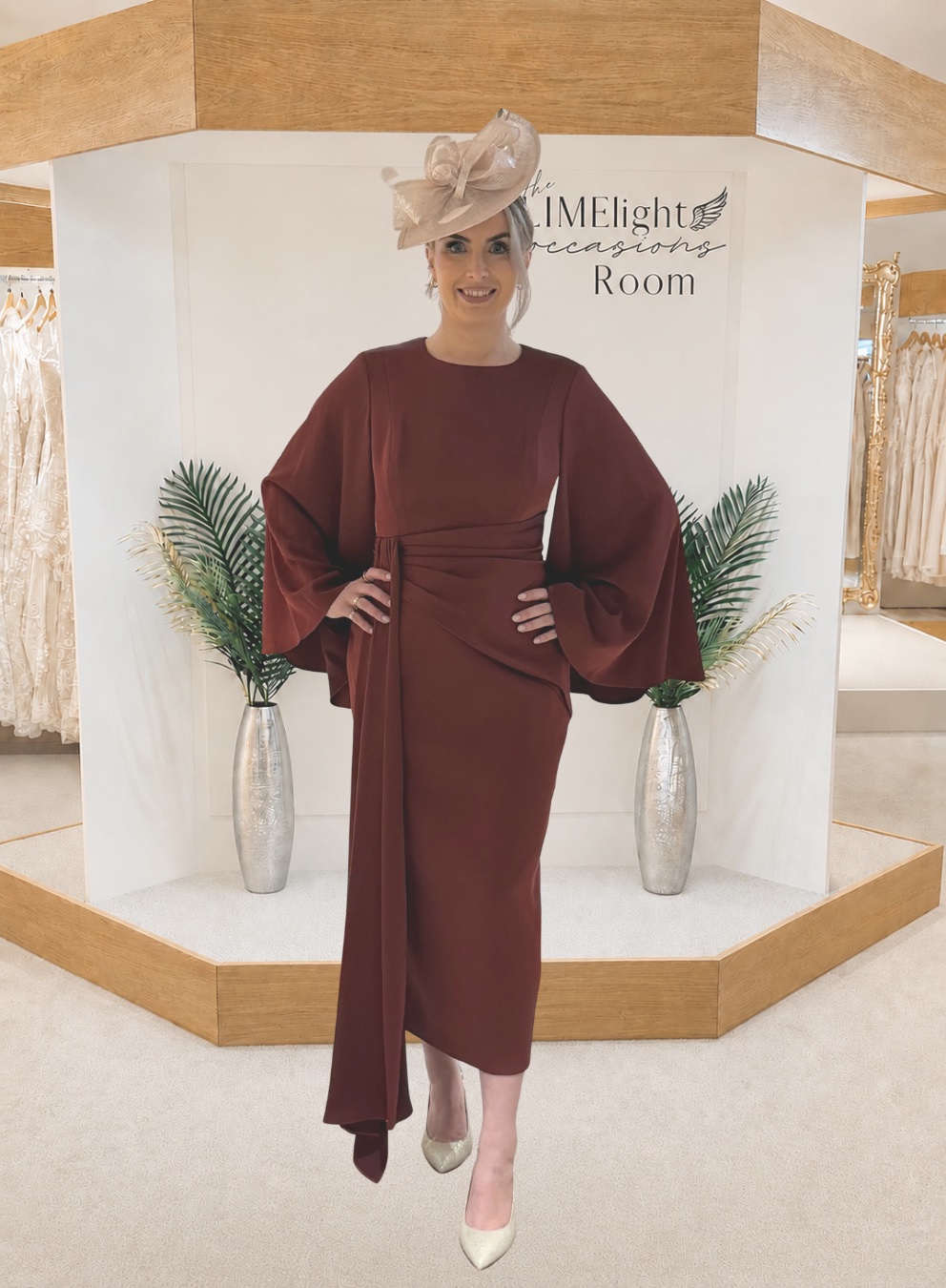Modern mother of the bride dress with fitted silhouette and statement bell sleeves front view with video.