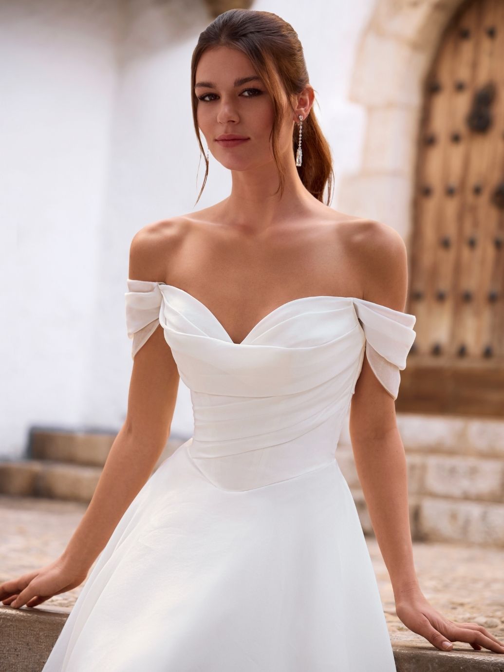 Enzoani Love Fralina wedding dress soft Aline with sweetheart neckline and drop sleeves close up front view.