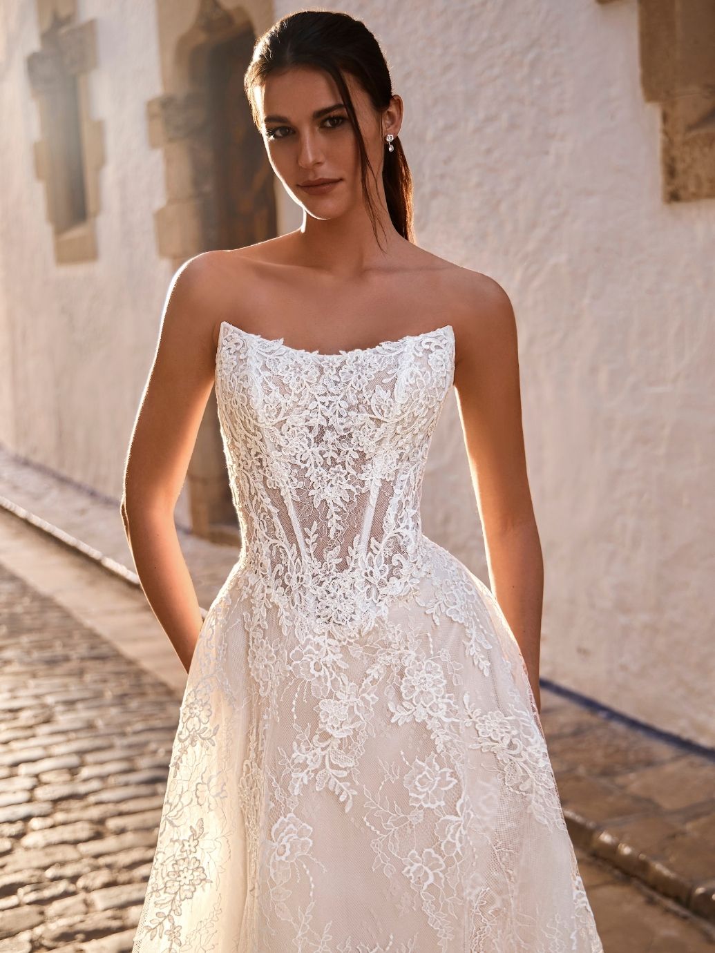 Enzoani Love Fravelle wedding dress gorgeous lace A line gown close up front view..