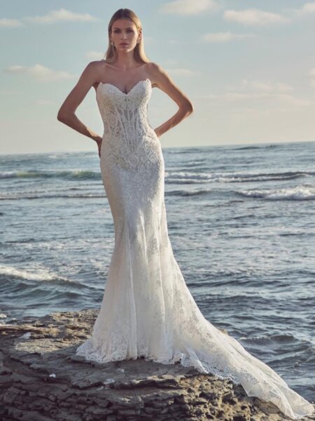 Calla Blanche Augusta wedding dress lace with fitted silhouette and plain detachable overskirt two looks in one the for perfect transformation from day to night front view.