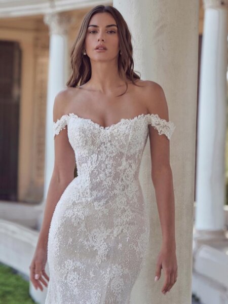 Calla Blanche fitted wedding dress in sparkling lace with sweetheart neckline and drop straps close up front view.