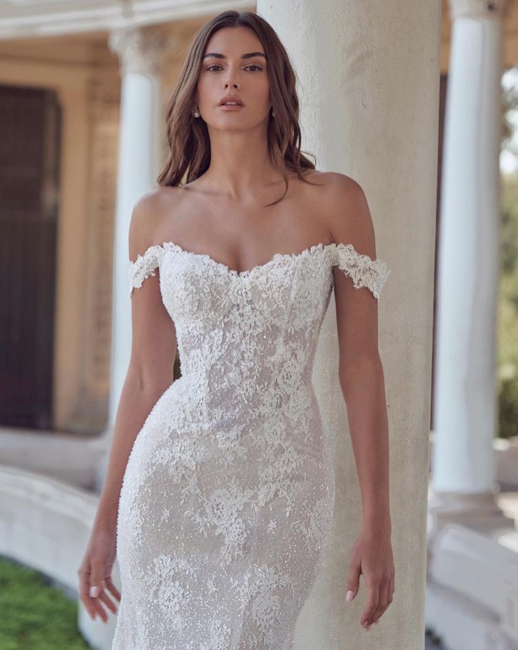 Calla Blanche fitted wedding dress in sparkling lace with sweetheart neckline and drop straps close up front view.