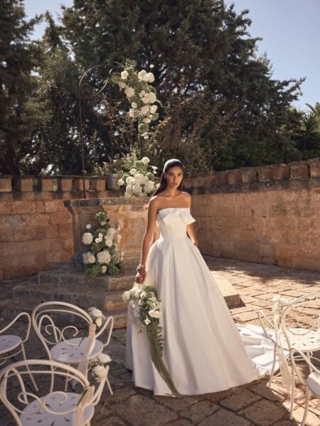 Modeca bridal Maranda ballgown wedding dress with optional bow and box pleats front view.
