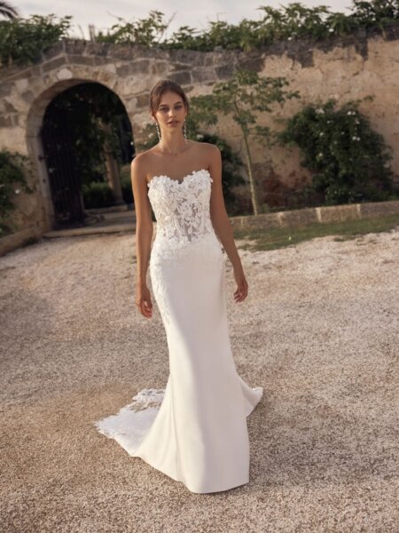Modeca bridal Marienne fitted wedding dress with lace sweetheart bodice and plain skirt with lace edging to the train front view.