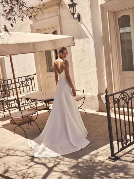 Modeca Myranda flattering A-line wedding dress with basque bodice with beaded bodice detail and slender straps scoop back view.