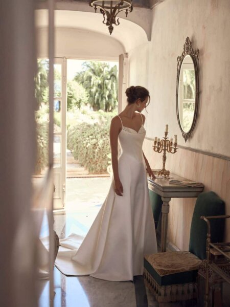 Modeca Myranda flattering A-line wedding dress with basque bodice with beaded bodice detail and slender straps front side view.